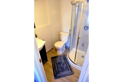 a bathroom with a toilet and a shower at Dream Catcher Travel House in Toronto