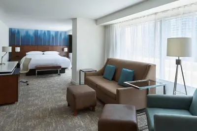 a hotel room with a bed and a bedroom at Toronto Marriott City Centre Hotel in Toronto