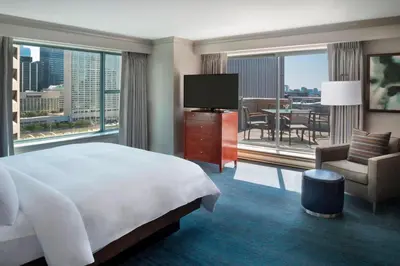 a hotel room with a bed and a large window at Marriott Downtown at CF Toronto Eaton Centre in Toronto