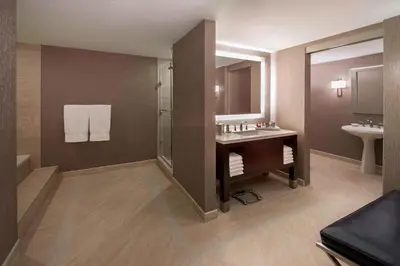 a large bathroom with a sink and a shower at Marriott Downtown at CF Toronto Eaton Centre in Toronto