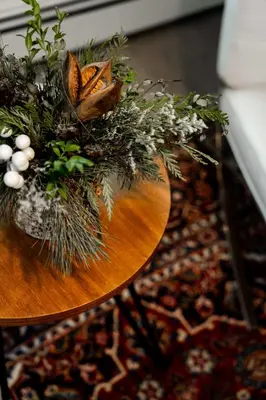 a table with a vase of flowers on it at South Landing Inn in Niagara on the Lake