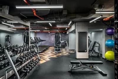 a gym with lots of tread machines and weights at Sheraton Toronto Airport Hotel & Conference Centre in Toronto