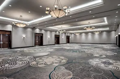 a large room with a large carpeted floor and chandeliers at Sheraton Toronto Airport Hotel & Conference Centre in Toronto