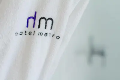 a white tshirt with the hm medical mecca on it at Hotel Metro in London