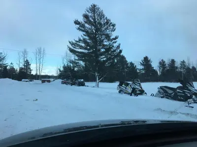 a group of motorcycles parked in the snow at Shenstone Motor Inn in Wiarton