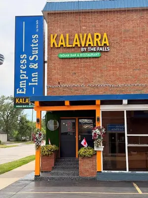 a kalamazoo restaurant with a sign on the side of a building at Empress Inn and Suites by the Falls in Niagara Falls
