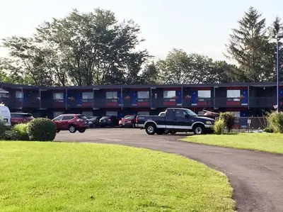 a truck parked in a parking lot in front of a building at Villager Lodge Niagara Falls in Niagara Falls