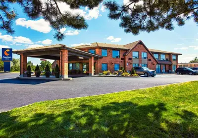 a building with a parking lot in front of it at Comfort Inn in Pickering