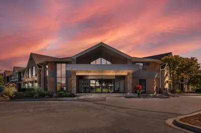 a building with a sunset in the sky at Comfort Inn in Burlington