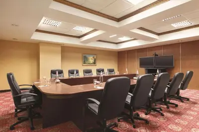 a large conference room with a long table and chairs at Radisson Hotel Toronto Airport West in Mississauga