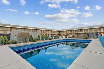 a swimming pool in front of a building at Niagara Lodge & Suites in Niagara Falls