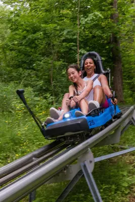 two women are riding on a roller coaster at The Westin Trillium House, Blue Mountain in Blue Mountains