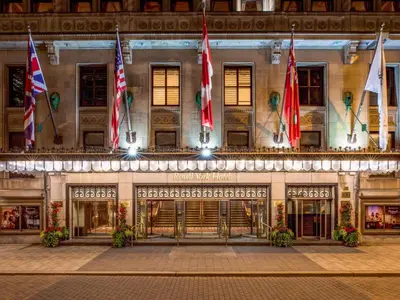 a building with flags on the front of it at Fairmont Royal York Hotel in Toronto
