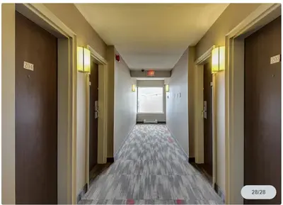 a corridor of a hallway with doors and a corridorngthngthngthngth at Spark by Hilton Oshawa in Oshawa