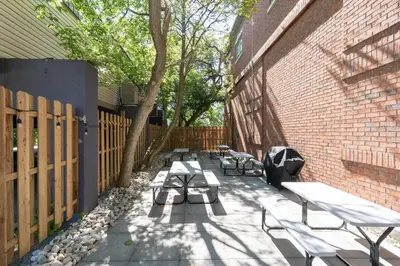 a group of benches sitting next to a brick building at Comfort Suites in London
