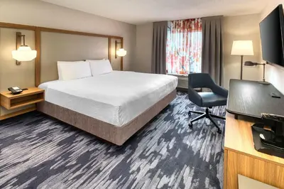 a hotel room with a bed and a desk at Fairfield Inn & Suites by Marriott Toronto Brampton in Brampton