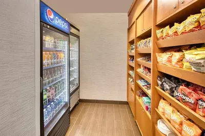 an aisle of a grocery store with a refrigerator at Fairfield Inn & Suites by Marriott Toronto Brampton in Brampton