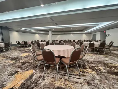 a conference room with a table and chairs in it at Holiday Inn Toronto Airport East by IHG in Toronto