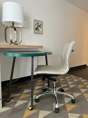 a desk and a chair in a room at Holiday Inn Toronto Airport East by IHG in Toronto