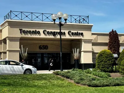 a car parked in front of a car dealership at Holiday Inn Toronto Airport East by IHG in Toronto