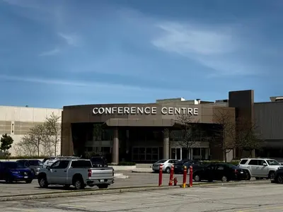 a conference center with cars parked in a parking lot at Holiday Inn Toronto Airport East by IHG in Toronto