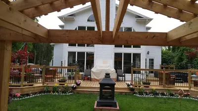 a large pergola in front of a house at The White House Boutique B&B in Niagara on the Lake