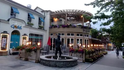 a statue of a man in front of a building at The White House Boutique B&B in Niagara on the Lake