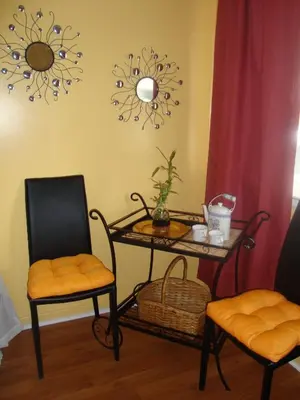 a room with a table and two chairs and a table at The Rex Motel At Niagara Falls in Niagara Falls