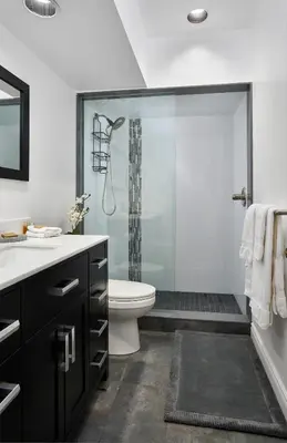 a bathroom with a shower with a toilet and a sink at Vine Village in Niagara on the Lake