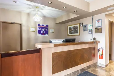 a lobby of a knights inn with a reception desk at Knights Inn Orillia in Orillia