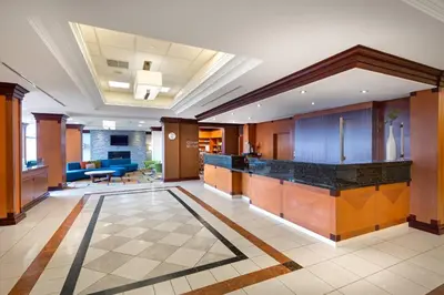an office lobby with a bar in the middle at Fairfield Inn & Suites by Marriott Toronto Airport in Mississauga