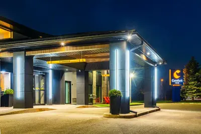 a gas station at night with blue lights at Comfort Inn in Guelph