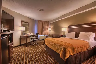 a hotel room with a bed and a desk at Comfort Inn in Guelph