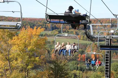 a group of people riding on a ski lift at Holiday Inn Burlington Conference Centre by IHG in Burlington