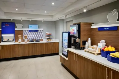 a store with a fruit counter in a store at Holiday Inn Express & Suites Kitchener Southeast by IHG in Kitchener
