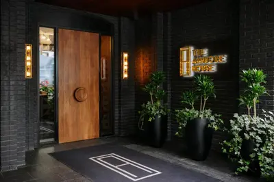 a front door of a building with potted plants at The Anndore House, part of JDV by Hyatt in Toronto
