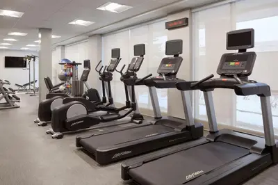 a row of treadmills in a gym at Courtyard by Marriott Toronto Mississauga/Meadowvale in Mississauga