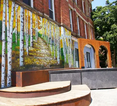 a painting of trees on the side of a building at The Alexandra Hotel in Toronto
