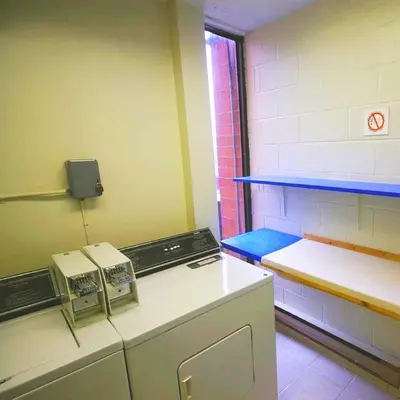 a kitchen with a stove and a counter in a room at The Alexandra Hotel in Toronto