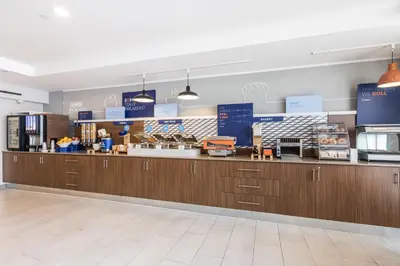 a store with wooden cabinets and a counter top at Holiday Inn Express Toronto-North York by IHG in Toronto