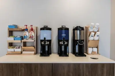 a counter top with a group of bottles on it at Holiday Inn Express Toronto-North York by IHG in Toronto