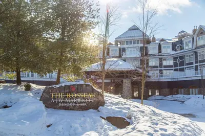 a sign in the snow in front of a building at JW Marriott The Rosseau Muskoka Resort & Spa in Minett