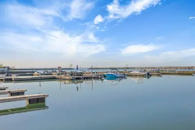 a large body of water with boats in it at The Jordan Hotel Ramada by Wyndham in Jordan