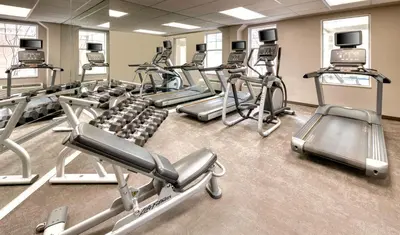 a gym with a bunch of cardio machines at Residence Inn by Marriott Whitby in Whitby