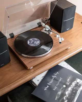 a record player sitting on a table with a record player at Kimpton Saint George Hotel by IHG in Toronto