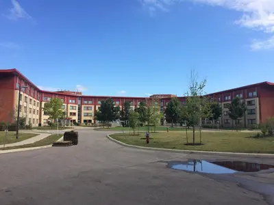 an empty parking lot in front of a building at Residence & Conference Centre - Oakville in Oakville