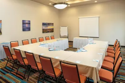 a conference room with a large table and chairs at Fairfield Inn & Suites by Marriott Belleville in Belleville
