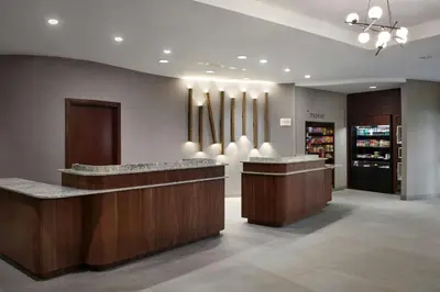 a lobby of a store with a counter and a pharmacy at Courtyard by Marriott Hamilton in Hamilton