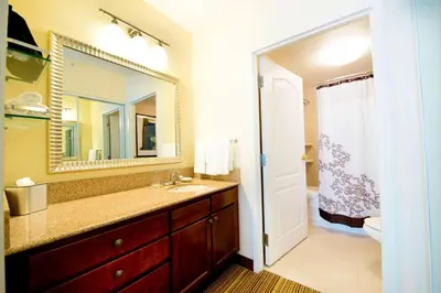 a bathroom with a sink and a mirror at Residence Inn by Marriott Mississauga-Airport Corporate Centre West in Mississauga