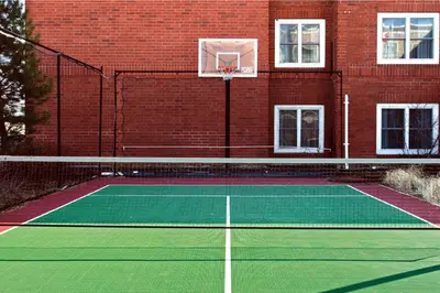 a tennis court in front of a brick building at Residence Inn by Marriott Toronto Markham in Markham